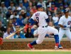 Chicago Cubs' Javier Baez watches his RBI-single during the fourth inning of a baseball game against the Los Angeles Angels, Monday, June 3, 2019, in Chicago. (AP Photo/Paul Beaty)