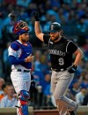 Colorado Rockies' Daniel Murphy right, celebrates at home plate after hitting a solo home run while Chicago Cubs catcher Victor Caratini left, looks on during the fourth inning of a baseball game Tuesday, June 4, 2019, in Chicago. (AP Photo/Paul Beaty)