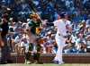 Chicago Cubs' Ian Happ (8) watches his grand slam home run against the Oakland Athletics during the fourth inning of a baseball game, Wednesday, Aug. 7, 2019, in Chicago. (AP Photo/David Banks)