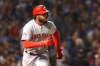 Cincinnati Reds' Phillip Ervin watches his sacrifice fly off Chicago Cubs relief pitcher Steve Cishek during the fourth inning of a baseball game Monday, Sept. 16, 2019, in Chicago. Jose Peraza scored on the play. (AP Photo/Charles Rex Arbogast)
