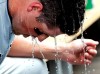 San Diego Padres' Hunter Renfroe cools off in the dugout after hitting a solo home run against the Chicago Cubs during the fifth inning of a baseball game in Chicago, Saturday, July 20, 2019. (AP Photo/Nam Y. Huh)