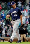 Milwaukee Brewers relief pitcher Burch Smith leaves the field after Chicago Cubs' Willson Contreras hit the game-winning solo home run during the 15th inning of a baseball game Saturday, May 11, 2019, in Chicago. The Cubs won 2-1. (AP Photo/Nam Y. Huh)