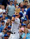 Chicago Cubs third baseman Kris Bryant catches a fly ball hit by Cincinnati Reds' Derek Dietrich in foul territory during the fourth inning of a baseball game Saturday, May 25, 2019, in Chicago. (AP Photo/Nam Y. Huh)