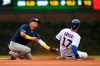 Milwaukee Brewers shortstop Orlando Arcia left, tries to apply the tag as Chicago Cubs' Kris Bryant steals second base during the eighth inning of a baseball game Sunday, Sept. 1, 2019, in Chicago. (AP Photo/Paul Beaty)