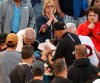 Emergency personal keep a towel on the face of a person who was struck by a line drive by Chicago White Sox's Eloy Jimenez during the fourth inning of a baseball game against the Washington Nationals, Monday, June 10, 2019, in Chicago. (AP Photo/Charles Rex Arbogast)