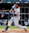 Cleveland Indians' Jose Ramirez hits a double against the Chicago White Sox during the first inning of a baseball game in Chicago, Friday, May 31, 2019. (AP Photo/Nam Y. Huh)