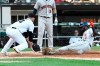 Houston Astros' Yordan Alvarez (44) is safe at home plate as Chicago White Sox starting pitcher Dylan Cease (84) makes a late tag during the sixth inning of game one of a baseball doubleheader, Tuesday, Aug. 13, 2019, in Chicago. (AP Photo/David Banks)