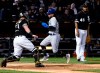 Toronto Blue Jays' Freddy Galvis, center, scores past Chicago White Sox catcher James McCann (33) and starting pitcher Ivan Nova (46) during the third inning of a baseball game Friday, May 17, 2019, in Chicago. (AP Photo/Matt Marton)