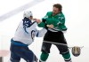 Dallas Stars forward Brett Ritchie (25) and Winnipeg Jets forward Adam Lowry (17) fight during the first period of an NHL hockey game, Saturday, Oct. 6, 2018, in Dallas. (AP Photo/Brandon Wade)