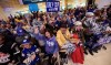 Winnipeg Blue Bombers fans cheer as the team arrives at the Winnipeg James Armstrong Richardson International Airport on Monday, November 25, 2019 after winning the Grey Cup Sunday night. THE CANADIAN PRESS/David Lipnowski