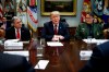 Mike McDaniel, director of Houston High Intensity Drug Trafficking Areas, left, and Carla Provost, chief of the U.S. Border Patrol, right, listen as President Donald Trump speaks in the Roosevelt Room of the White House, Wednesday, March 13, 2019, in Washington. Trump said the U.S. is issuing an emergency order grounding all Boeing 737 Max 8 and Max 9 aircraft 