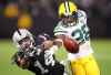 Green Bay Packers cornerback Josh Hawkins (28) breaks up a pass intended for Oakland Raiders wide receiver Keon Hatcher (14) during the second half of an NFL preseason football game in Oakland, Calif., Friday, Aug. 24, 2018.The promoter of a an NFL exhibition game in Winnipeg later this month has lowered the price of some lower-bowl tickets. THE CANADIAN PRESS/AP/Ben Margot