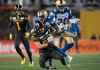 Winnipeg Blue Bombers' Brandon Alexander tackles Hamilton Tiger-Cats' Jaelon Acklin during the second half of the 107th Grey Cup. (Nathan Denette / Canadian Press)