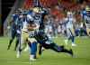 Nathan Denette / The Canadian Press 
Toronto Argonauts defensive back Qudarius Ford (21) makes the tackle but not before Winnipeg Blue Bombers running back Andrew Harris (33) made the first down during second half on Thursday.