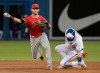 Toronto Blue Jays' Cavan Biggio, right, gets caught out on the force out at second base as Los Angeles Angels' Tommy La Stella turns the double play during seventh inning American League MLB baseball action in Toronto, Monday, June 17, 2019. THE CANADIAN PRESS/Fred Thornhill