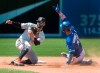 Toronto Blue Jays Lourdes Gurriel Jr. safely steals second base beating the tag attempt by Baltimore Orioles Jonathan Villar in the seventh inning of their American League MLB baseball game in Toronto, Sunday, July 7, 2019. THE CANADIAN PRESS/Fred Thornhill