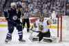 THE CANADIAN PRESS / Trevor Hagan
Winnipeg Jets' Adam Lowry and Vegas Golden Knights' Deryk Engelland battle in front of goaltender Marc-Andre Fleury during the second period of Game 2 of the Western Conference Finals in Winnipeg, Monday.