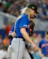 New York Mets starting pitcher Noah Syndergaard talks with catcher Tomas Nido, left, in the sixth inning of a baseball game, Sunday, May 19, 2019, in Miami. (AP Photo/Lynne Sladky)
