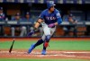 Texas Rangers' Ronald Guzman drops his bat after hitting a two-run double against the Tampa Bay Rays during the second inning of a baseball game Friday, June 28, 2019, in St. Petersburg, Fla. (AP Photo/Mike Carlson)