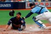 Minnesota Twins' Byron Buxton slides past home to score in front of Tampa Bay Rays catcher Mike Zunino during the fifth inning of a baseball game Sunday, June 2, 2019, in St. Petersburg, Fla. (AP Photo/Scott Audette)