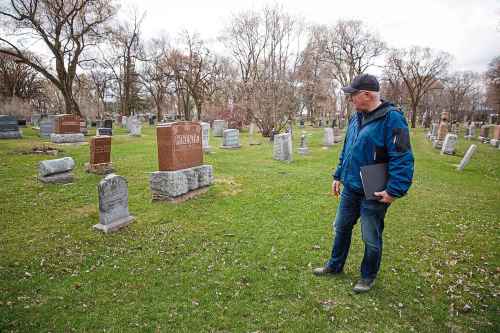 Paul Moist at the gravesite of Fred Dixon.