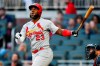 St. Louis Cardinals' Marcell Ozuna watches his three-run home run during the first inning of the team's baseball game against the Atlanta Braves, Tuesday, May 14, 2019, in Atlanta. (AP Photo/John Amis)