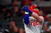 Philadelphia Phillies right fielder Bryce Harper (3) follows through on a two-run home run in the fourth inning of a baseball game against the Atlanta Braves Wednesday, Sept. 18, 2019, in Atlanta. (AP Photo/John Bazemore)