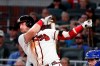 Atlanta Braves' Josh Donaldson follows through on a two-run double in the fifth inning of the team's baseball game against the Toronto Blue Jays on Tuesday, Sept. 3, 2019, in Atlanta. (AP Photo/John Bazemore)