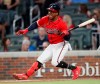 Atlanta Braves second baseman Ozzie Albies stumbles as he bats against the Milwaukee Brewers during the sixth inning of a baseball game Friday, May 17, 2019, in Atlanta. (AP Photo/John Bazemore)