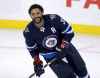 TREVOR HAGAN / THE CANADIAN PRESS FILES 
Dustin Byfuglien's leave of absence is fuelling speculation the big blue-liner is pondering retirement, a huge blow to the Winnipeg Jets.