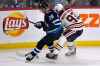 FRED GREENSLADE / THE CANADIAN PRESS
Winnipeg Jets' Jack Roslovic (28) and Edmonton Oilers' Ryan Nugent-Hopkins (93) chase a loose puck during the first period Sunday.