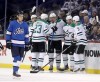 CP
Dallas Stars' Mattias Janmark (13), Esa Lindell (23), Radek Faksa (12), Blake Comeau (15) and John Klingberg (3) celebrate after Faksa scored against the Winnipeg Jets. Jet Sami Niku (83) looks on during second period NHL hockey action in Winnipeg, Monday, March 25, 2019. Trevor Hagan / The Canadian Press