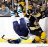 Michael Dwyer / THE CANADIAN PRESS
Boston Bruins' Brad Marchand, right, trips Vancouver Canucks' Sami Salo, left, in the second period of an NHL hockey game in Boston, Saturday, Jan. 7. Bruins general Manager Peter Chiarelli is angered after Marchand was suspended five games by the NHL for this hit.