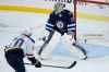 Connor Hellebuyck will get the start Sunday despite a rough outting on Friday. (John Woods / The Canadian Press)