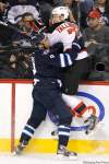 John Woods / The Canadian Press
The Winnipeg Jets' Evander Kane (9) takes out New Jersey Devils' Henrik Tallinder (7) during second period NHL action in Winnipeg on Saturday.