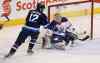 Trevor Hagan / The Canadian Press 
Winnipeg Jets' Drew Stafford (12) fails to hit a flying puck past Edmonton Oilers' goalie Cam Talbot (33) during the first period of Sunday's game in Winnipeg.