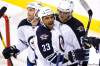 John Woods / THE CANADIAN PRESS
Winnipeg Jets Andrew Ladd, Dustin Byfuglien and  Nik Antropov celebrate their fifth goal against the Columbus Blue Jackets during third period pre-season NHL action in Winnipeg on Tuesday.