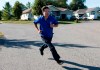 Pierre Poilievre, Conservative candidate for Carleton, runs to the next house while campaigning door to door ahead of the 2019 federal election, in the Ottawa community of Greely, on Tuesday, Sept. 17, 2019. THE CANADIAN PRESS/Justin Tang