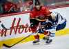 .THE CANADIAN PRESS/Jeff McIntosh
Winnipeg Jets' David Gustafsson, right, tires to get past Calgary Flames' Travis Hamonic during second period NHL pre-season hockey action in Calgary, Tuesday.