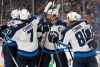 CP
Winnipeg Jets' Dustin Byfuglien (33), Ben Chiarot (7), Blake Wheeler (26) and Kyle Connor (81) celebrate with Mark Scheifele (55) after Scheifele scored a goal against the St. Louis Blues during the third period in Game 4 of an NHL first-round hockey playoff series Tuesday, April 16, 2019, in St. Louis. (AP Photo/Jeff Roberson)