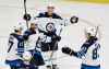 (AP Photo/Mark Zaleski)
Winnipeg Jets left wing Brandon Tanev, top, celebrates with teammates after scoring a goal against the Nashville Predators during the third period of an NHL hockey game Thursday, Jan. 17, 2019, in Nashville, Tenn. The Jets won 5-1.