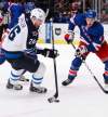 Frank Franklin II/ The Associated Press archives
Winnipeg Jets' Blake Wheeler and New York Rangers' Michael Del Zotto vie for control of the puck during the first period of  game Tuesday, Jan. 24, 2012, in New York.  Wheeler is one of several Jets taking a cruise during the break.