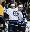 Mark Humphrey / The Canadian Press
Winnipeg Jets right wing Spencer Machacek, left, celebrates with Evander Kane (9) after scoring against the Nashville Predators in the first period of a preseason NHL hockey game on Saturday, Sept. 24, 2011, in Nashville, Tenn.