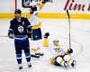 Nashville Predators' Viktor Arvidsson (33) and Filip Forsberg (9) celebrate Arvidsson's goal against the Winnipeg Jets as Mark Scheifele skates away during first period NH playoff action in Winnipeg on Monday, May 7, 2018. THE CANADIAN PRESS/John Woods