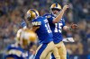 Matt Nichols and Nic Demski celebrate Demski's touchdown during the second half of Friday's game against Hamilton. Nichols completed 13 of 24 passes for 180 yards, two touchdowns and zero interceptions. (John Woods / The Canadian Press)