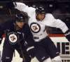 KEN GIGLIOTTI / WINNIPEG FREE PRESS
Jets captain Andrew Ladd gets tangled up with No. 6 Ron Hainsey as Ladd prepares for his return with the Jets to Chicago, where he played and won a Stanley Cup playing for the Blackhawks.