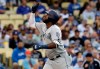 San Diego Padres' Franmil Reyes points skyward after hitting a solo home run against the Los Angeles Dodgers during the first inning of a baseball game Tuesday, May 14, 2019, in Los Angeles. (AP Photo/Marcio Jose Sanchez)