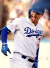 Los Angeles Dodgers' Joc Pederson sticks his tongue out at his own dugout after hitting a solo home run during the first inning of a baseball game against the Colorado Rockies Monday, Sept. 2, 2019, in Los Angeles. (AP Photo/Mark J. Terrill)