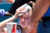 A young fan holds ice to her head after being hit with a foul ball hit by Los Angeles Dodgers' Cody Bellinger during the first inning of a baseball game against the Colorado Rockies, Sunday, June 23, 2019, in Los Angeles. (AP Photo/Mark J. Terrill)