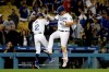 Los Angeles Dodgers' Joc Pederson, right, celebrates with third base coach Dino Ebel (12) after hitting a solo home run during the ninth inning of a baseball game against the New York Mets Wednesday, May 29, 2019, in Los Angeles. (AP Photo/Marcio Jose Sanchez)